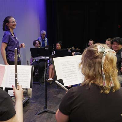 Teacher demonstrating orchestra conducting