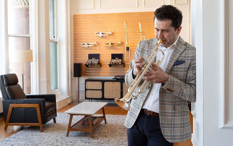 Artist playing a trumpet