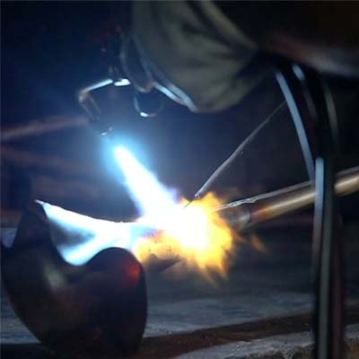 Bach trumpet bell in fire