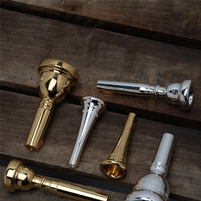 Mixture of mouthpieces atop wood planks