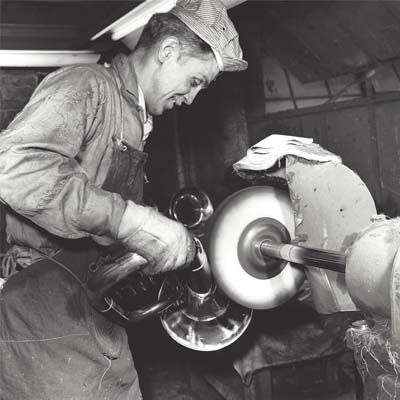 Employee Buffing a Baritone
