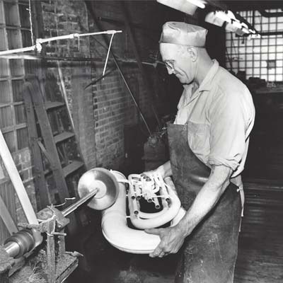 Employee Buffing a King Instrument