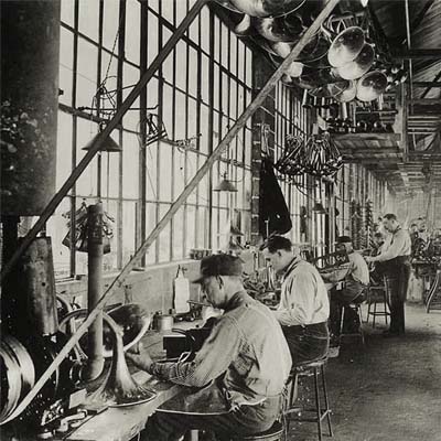 Historic picture of CG Conn workers making French horns