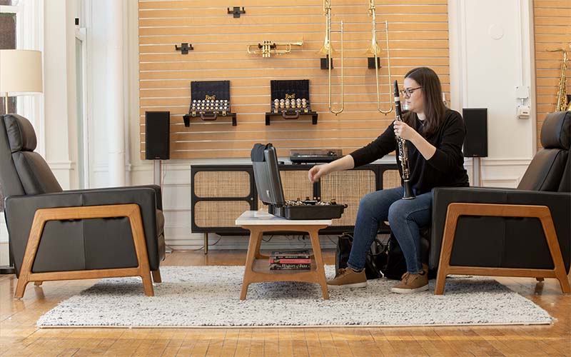 Artist disassembling a clarinet