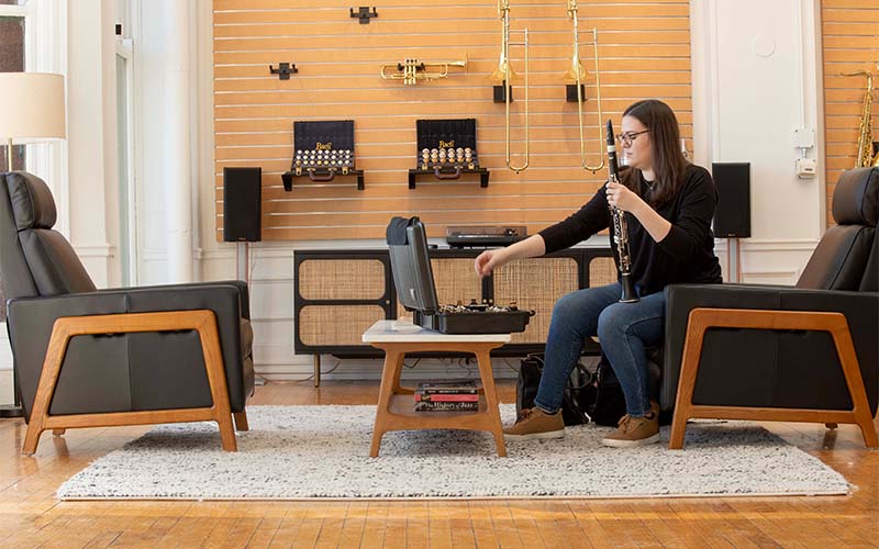 Artist disassembling a clarinet