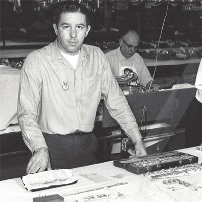 Employees inspecting flutes