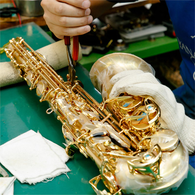 Saxophone being built by hand