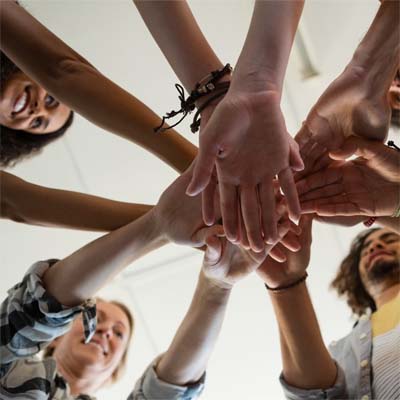 Placing hands in center of a huddled