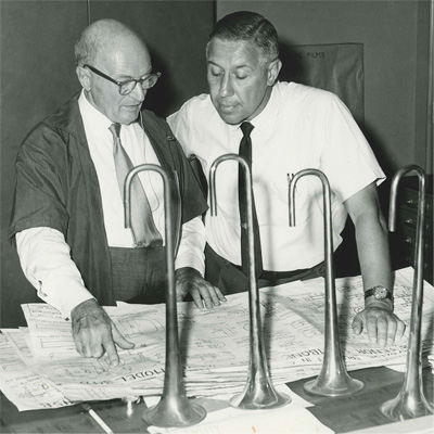 Vincent Bach inspecting a blueprint