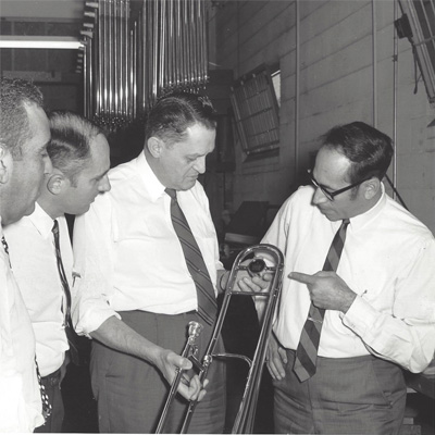 Employees inspecting a King trombone
