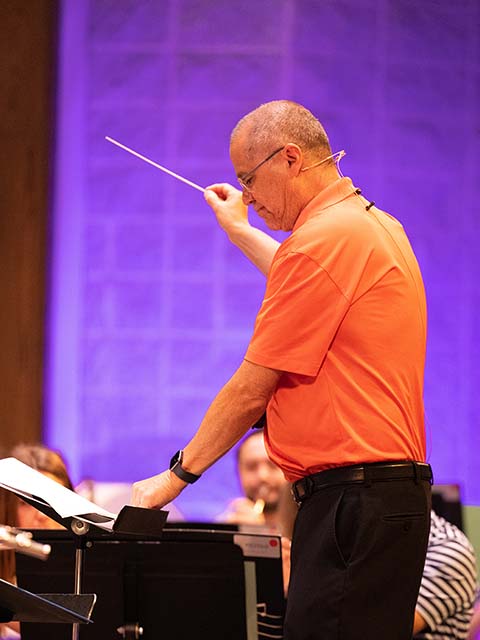 Richard Saucedo conducting a student band