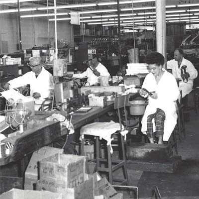 Historic image of King employees assembling trumpets