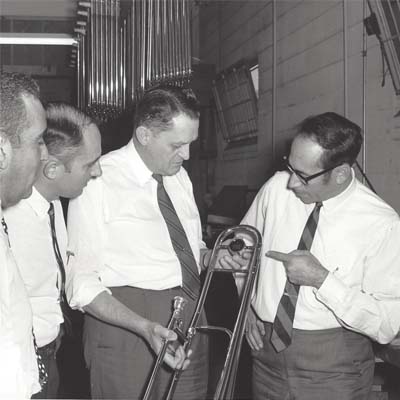 King employees inspecting a trombone
