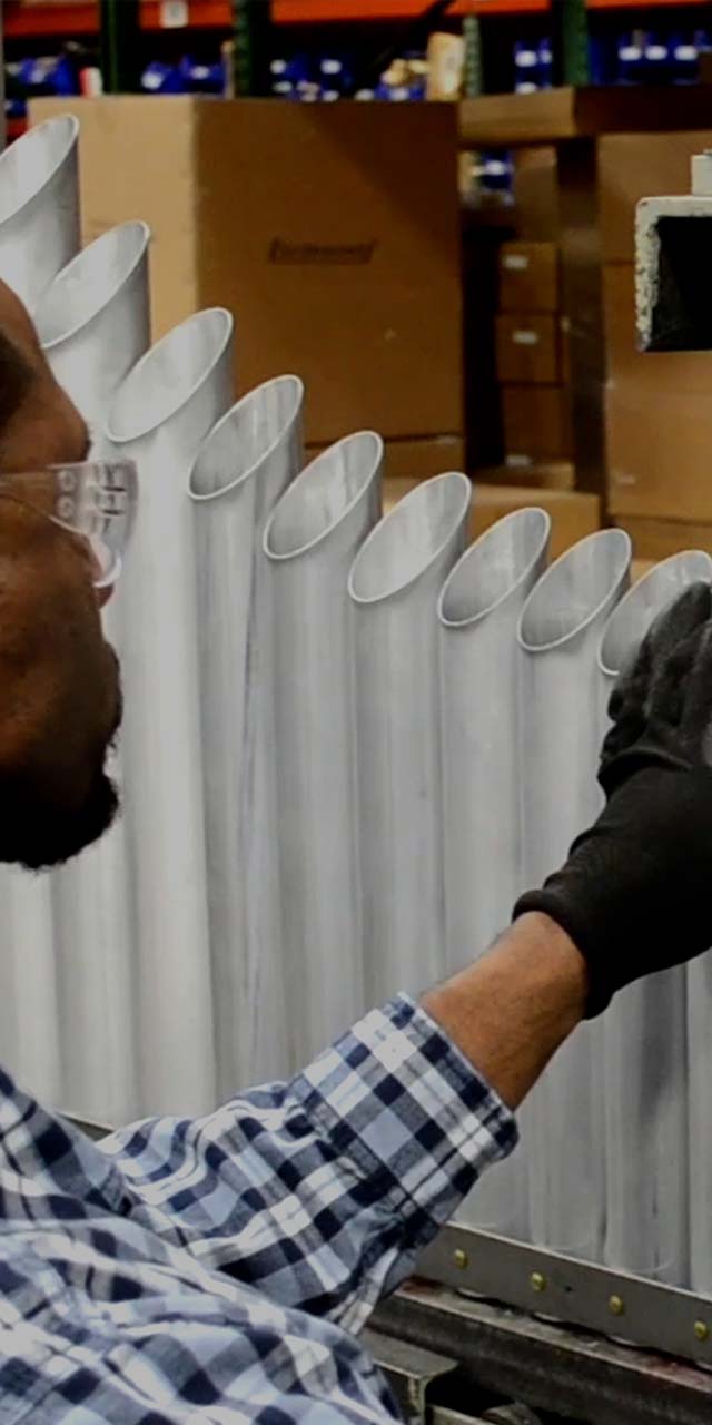 An employee working on a marimba