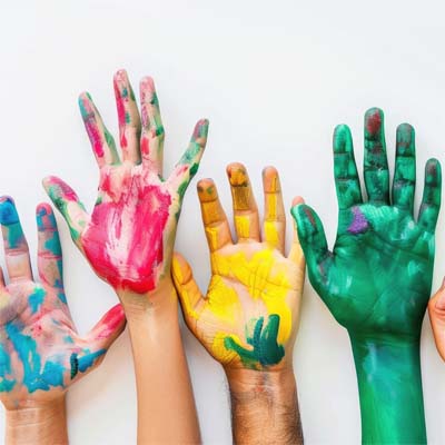 A row of painted hands being raised