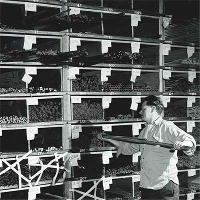 Bach employee picking out brass tubing