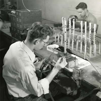 Employees hand-crafing flutes