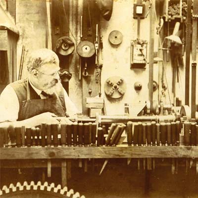 Employee working at a toolbench