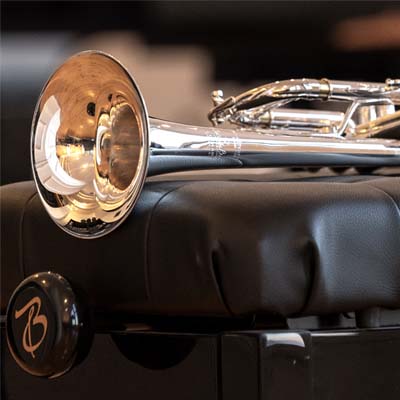 Trumpet sitting on piano bench
