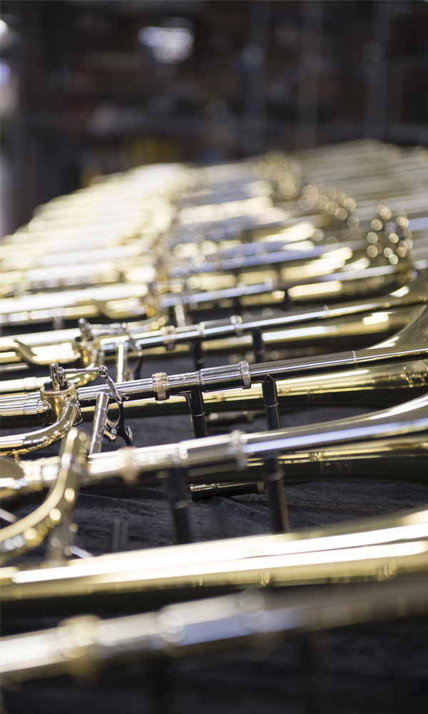 A collection of brand new trombones