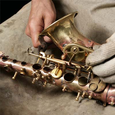Yanagisawa employee working on saxophone